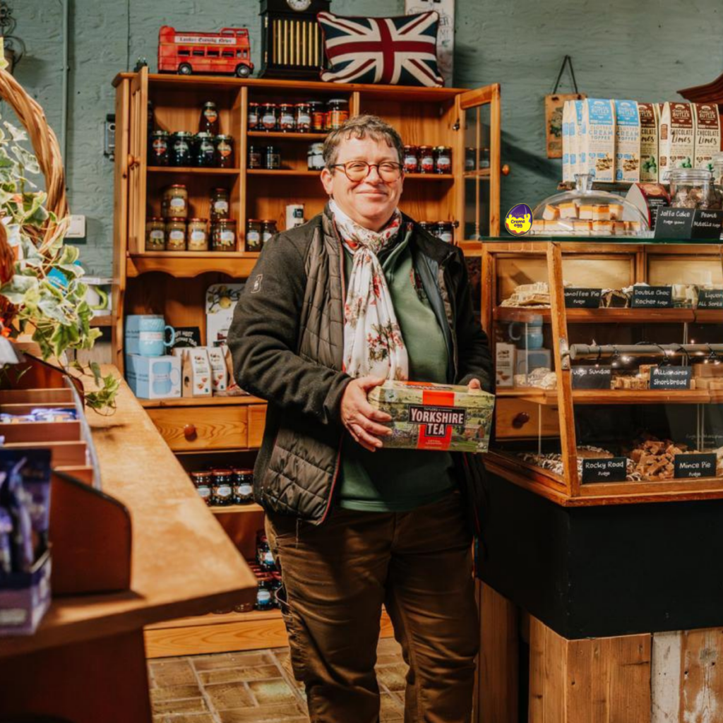Corina in the Krans Farm Shop surrounded by British products and Yorkshire Tea